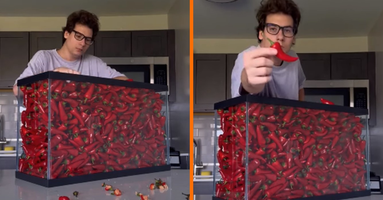 a man holding a red pepper in a container