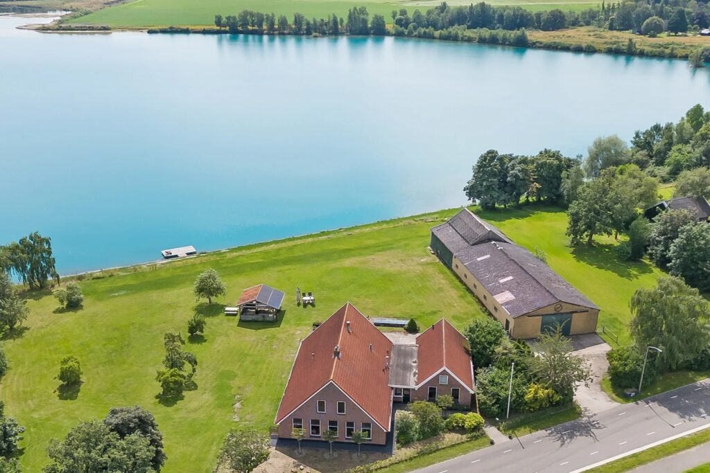 Kolossale woonboerderij met privéstrand te koop op Funda